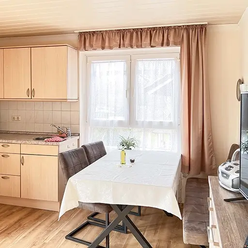 Wohnzimmer mit Küche